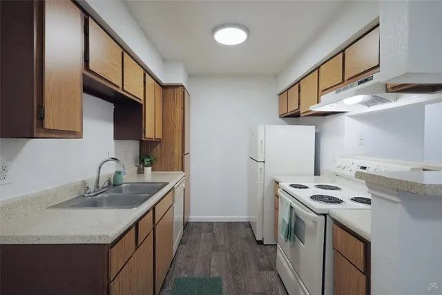 a room with a sink and a microwave