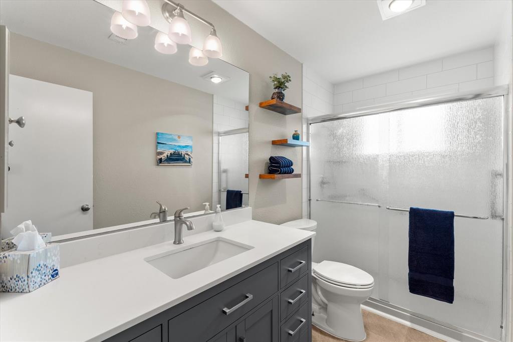 821 Baxter Drive Plano, TX 75025 - Photo 11 of 29 Beautifully updated bathroom with large walk in shower.