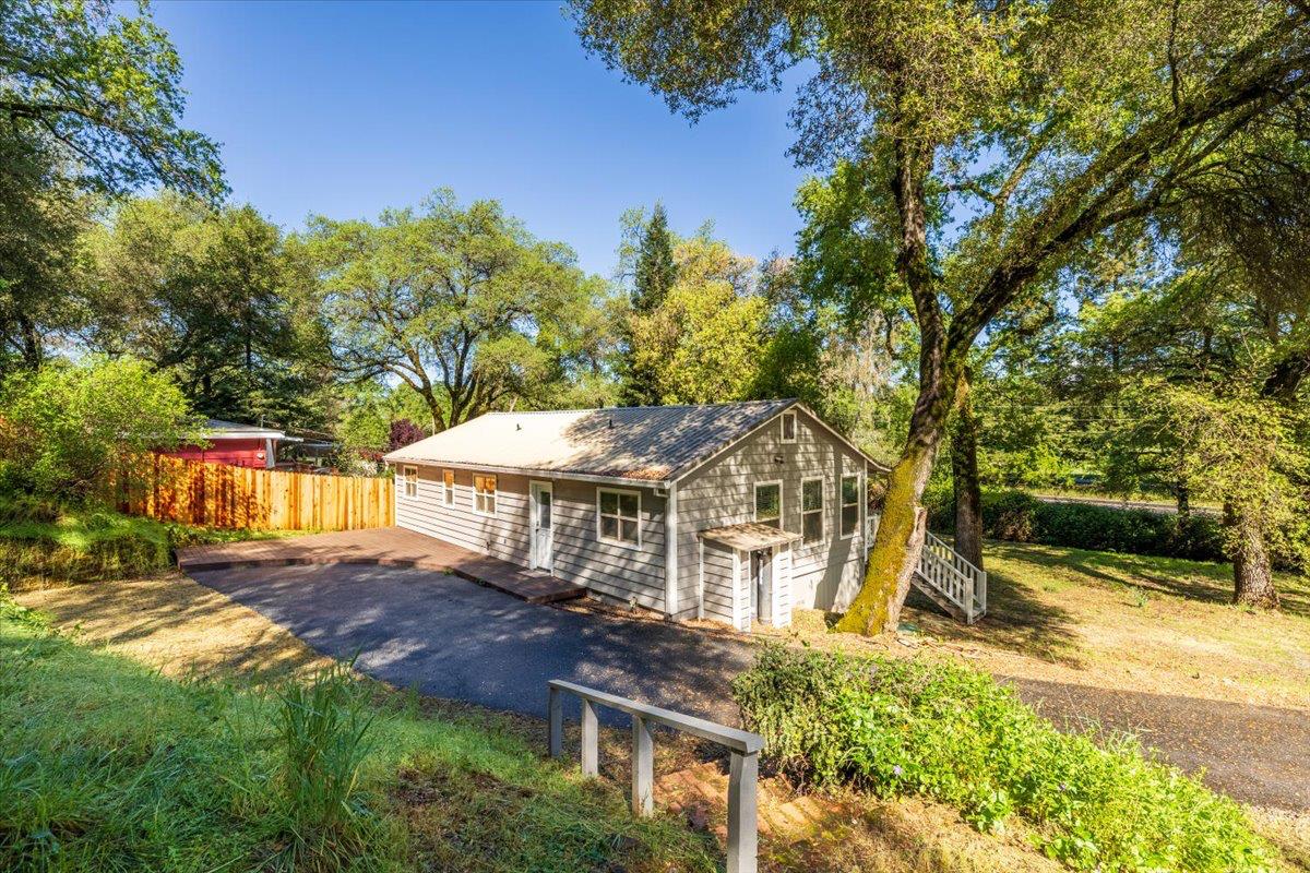 13630 Dry Creek Road Auburn, CA 95602 - Photo 11 of 46 a view of a house with a big yard
