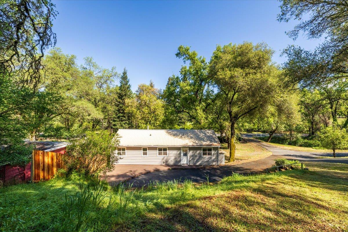 13630 Dry Creek Road Auburn, CA 95602 - Photo 12 of 46 a view of a house with a yard
