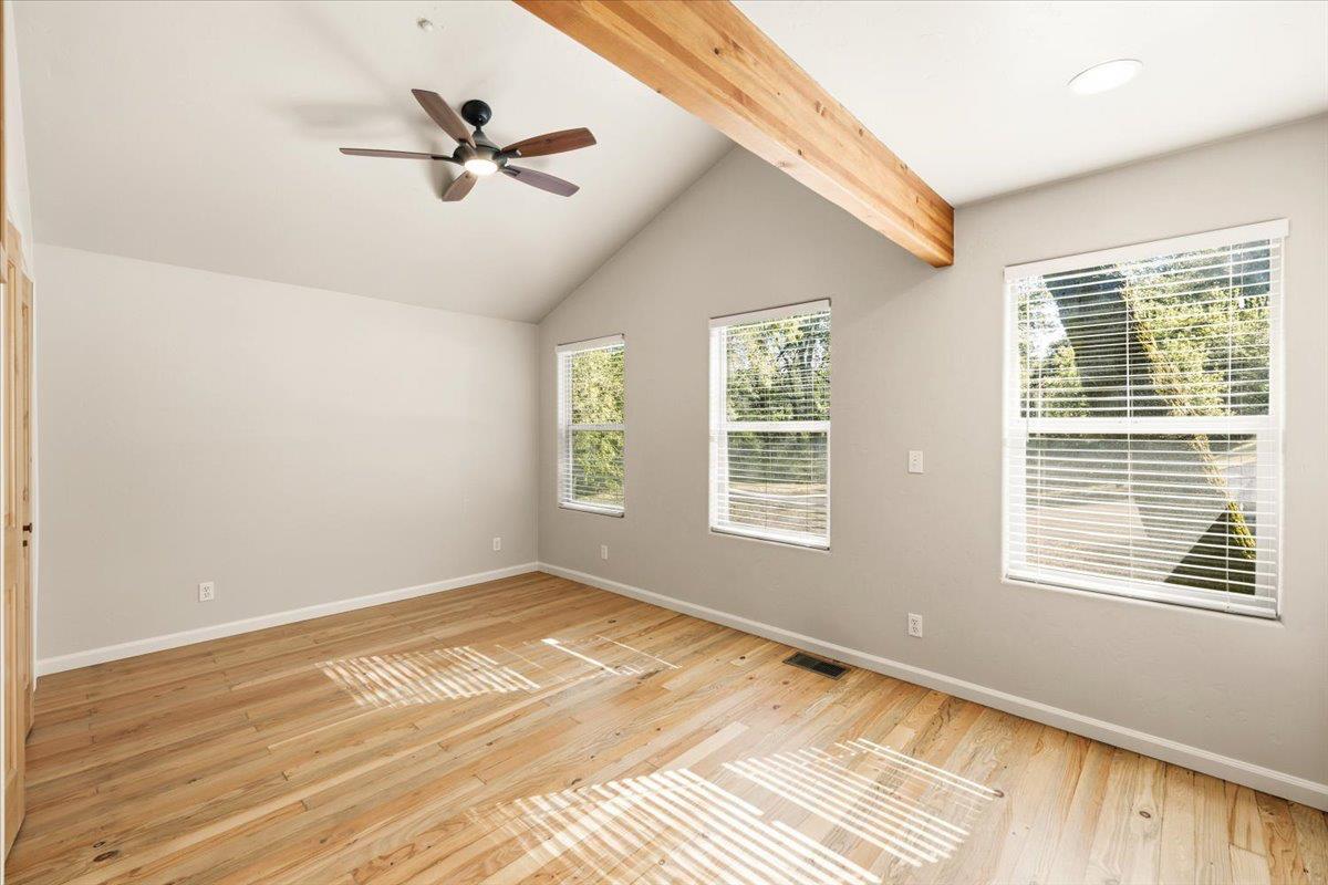 13630 Dry Creek Road Auburn, CA 95602 - Photo 34 of 46 a view of a livingroom with a ceiling fan and window