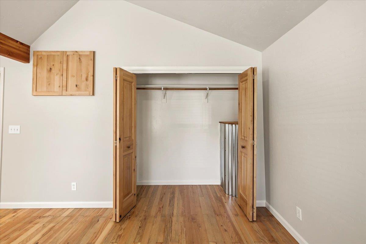 13630 Dry Creek Road Auburn, CA 95602 - Photo 36 of 46 a view of an empty room with wooden floor and a window