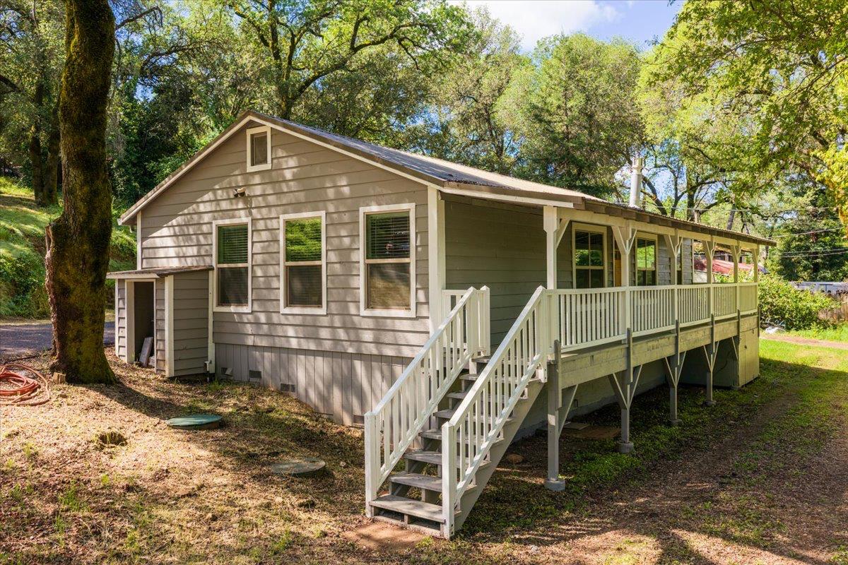 13630 Dry Creek Road Auburn, CA 95602 - Photo 6 of 46 a front view of a house with balcony