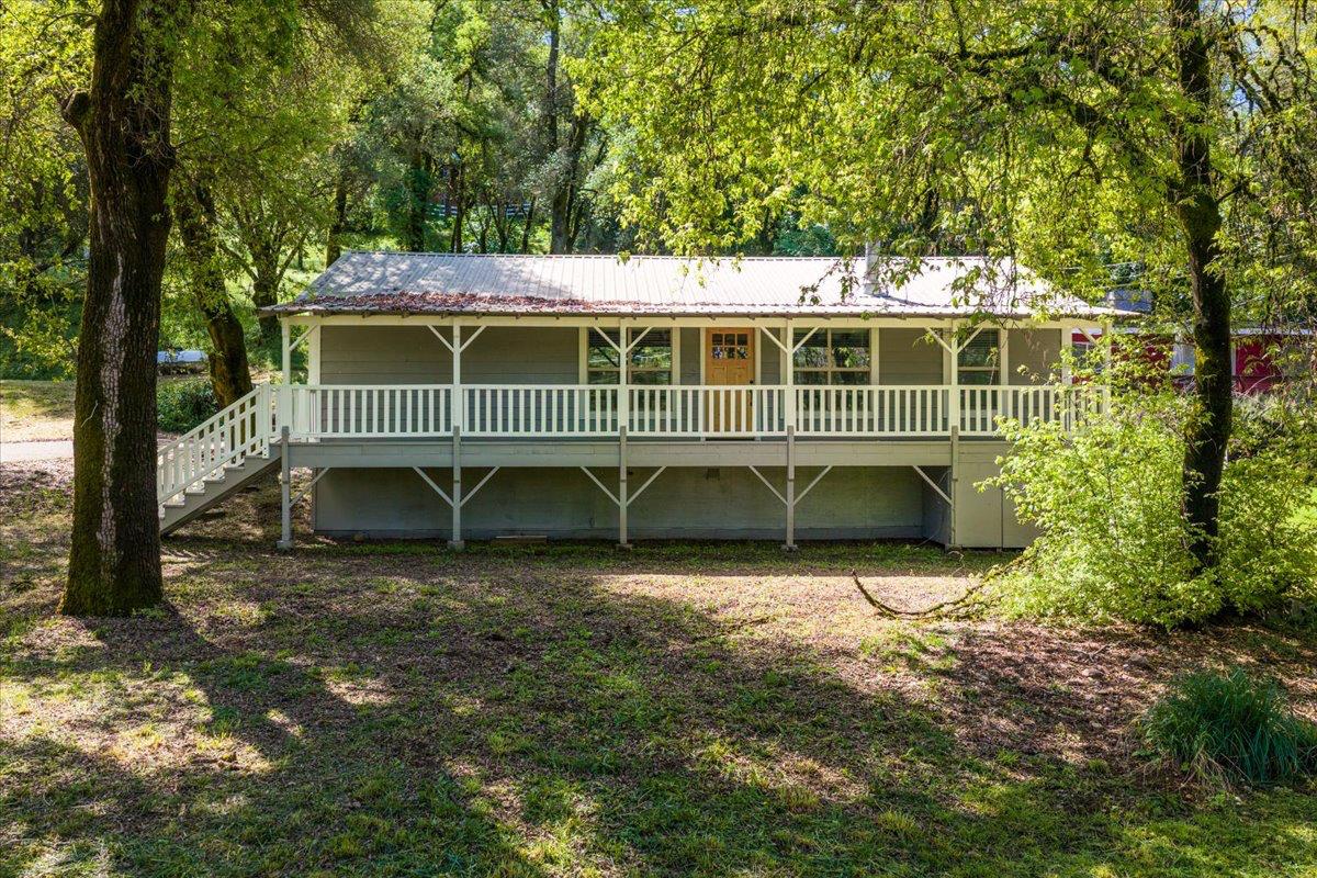 13630 Dry Creek Road Auburn, CA 95602 - Photo 8 of 46 a view of a house with a yard