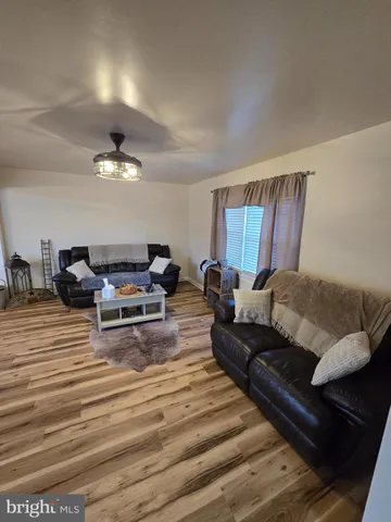 a view of a kitchen with a sink and cabinets