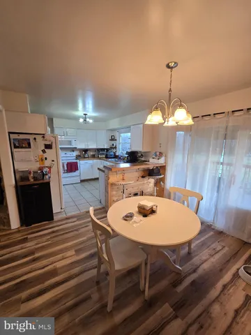 a bedroom with furniture and a mirror