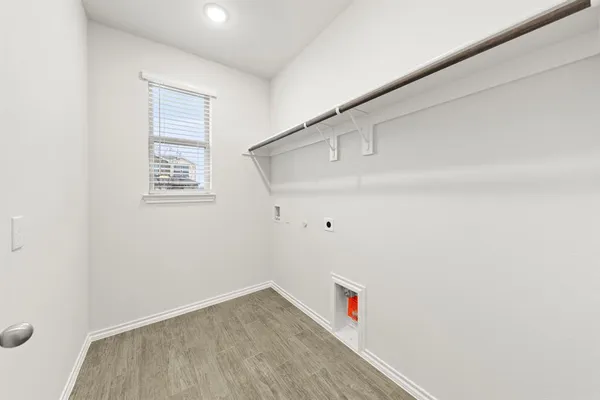 a view of an empty room and a window