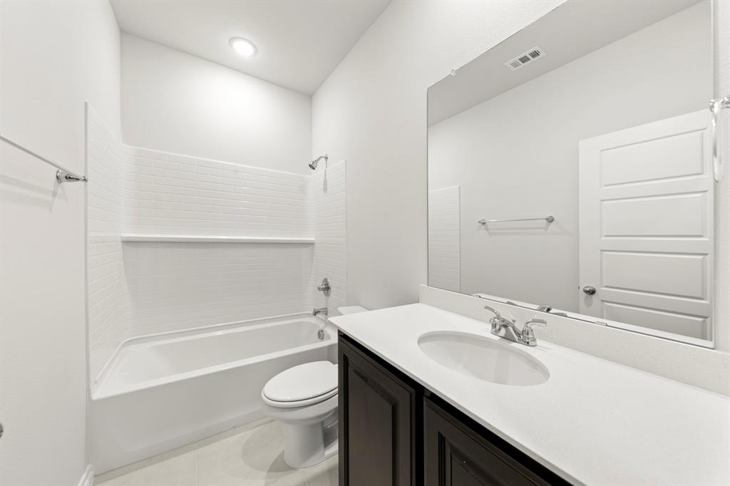 1708 Potomac Lane Blue Ridge, TX 75424 - Photo 17 of 27 a bathroom with a sink a toilet and shower