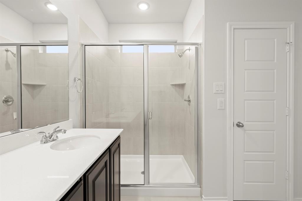 1708 Potomac Lane Blue Ridge, TX 75424 - Photo 21 of 27 a bathroom with a shower sink and mirror