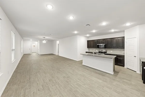 a view of kitchen with stainless steel appliances kitchen island