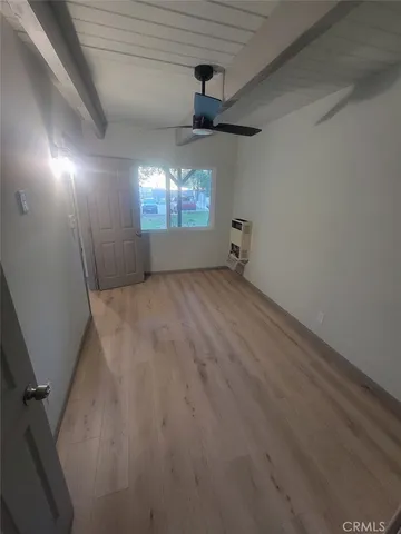 an empty room with a empty space and windows