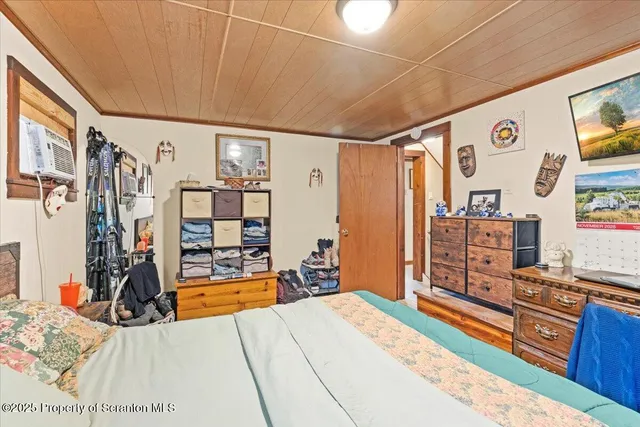 a room with furniture and a flat screen tv