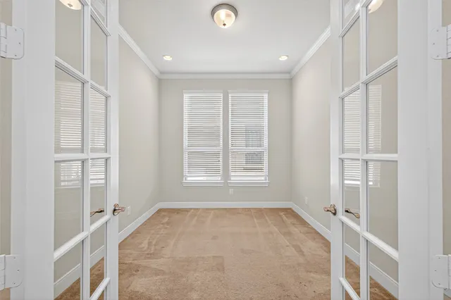 a view of an empty room with a window