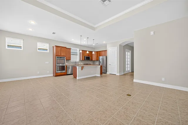 a view of a kitchen with a sink and white cabinets
