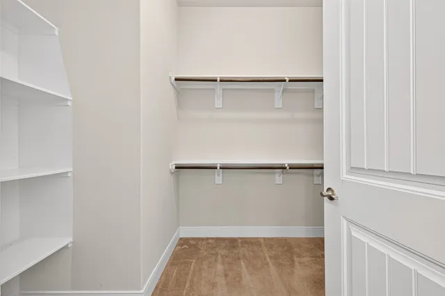 a view of an empty walk in closet