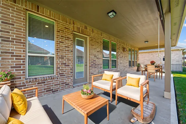 a backyard of a house with sofas
