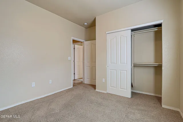 a bathroom with a granite countertop sink toilet a mirror and shower