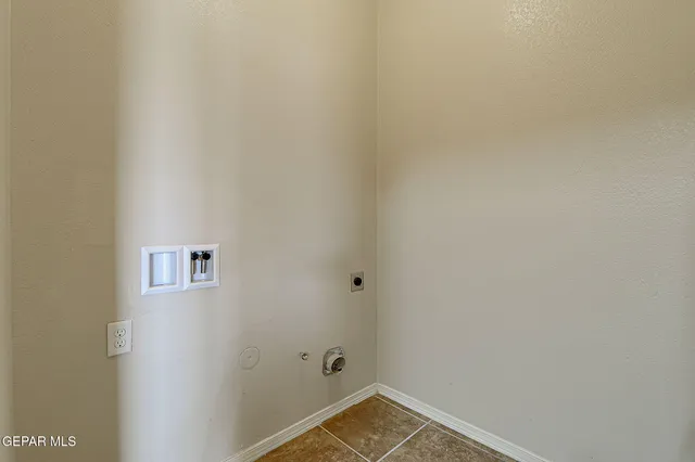a kitchen with a refrigerator and a sink