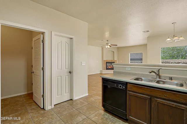 a view of an empty room with a fireplace