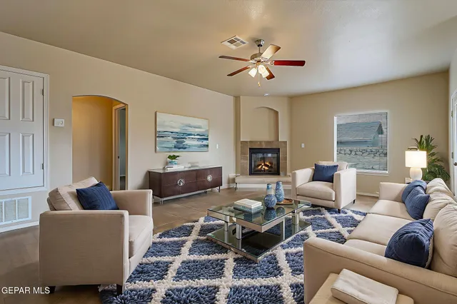 a view of a livingroom with furniture and chandelier