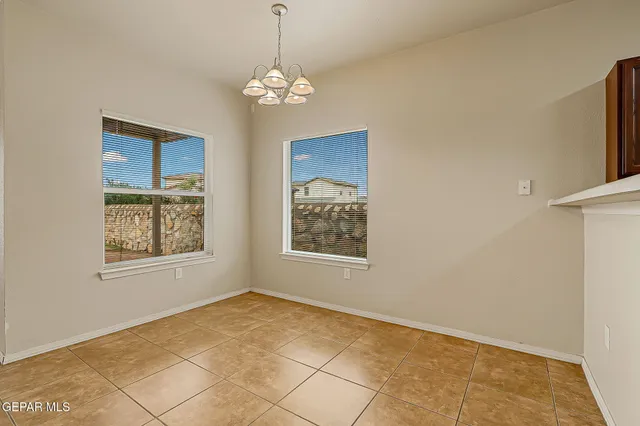 a view of a livingroom with a ceiling fan and window
