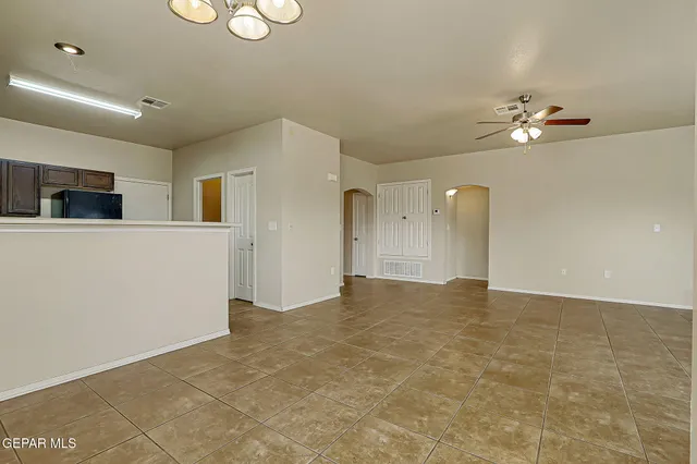 a bedroom with a bed and a potted plant