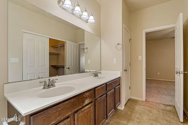 a view of a house with backyard and a tree