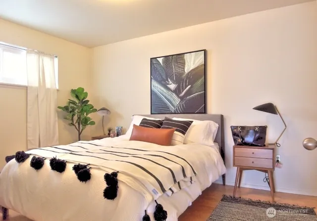 a bedroom with bed and a window