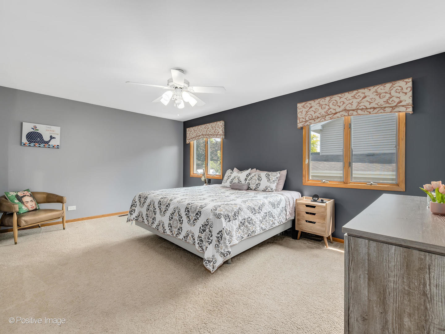 516 Camdon Circle Bartlett, IL 60103 - Photo 14 of 34 a bedroom with a bed and a chandelier