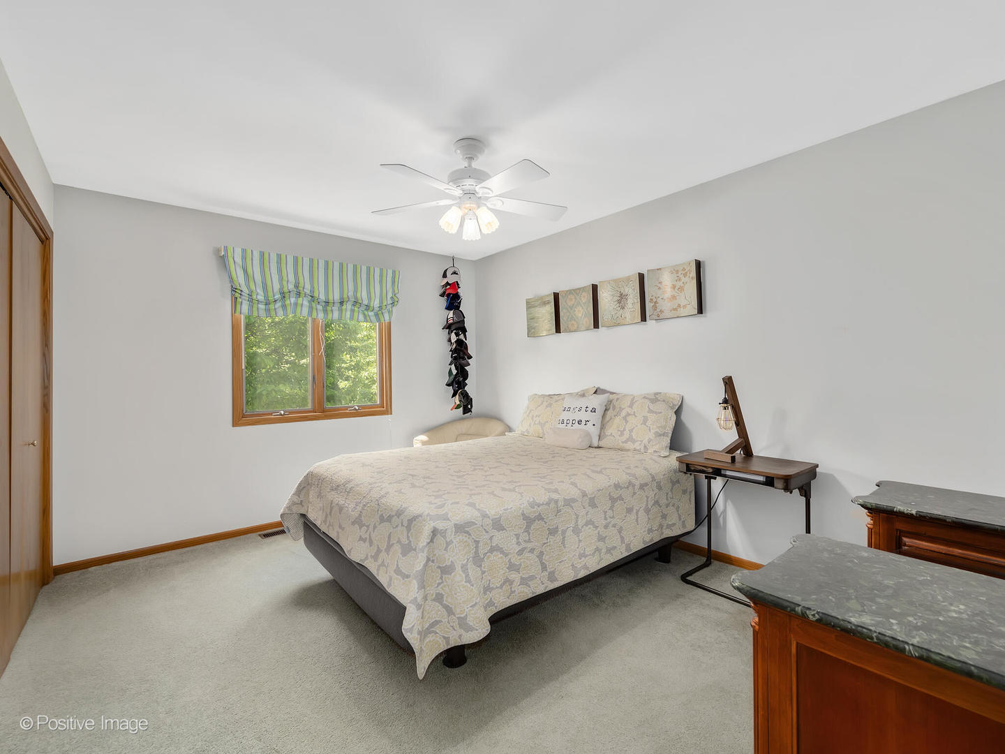 516 Camdon Circle Bartlett, IL 60103 - Photo 20 of 34 a bedroom with a bed and a table in it