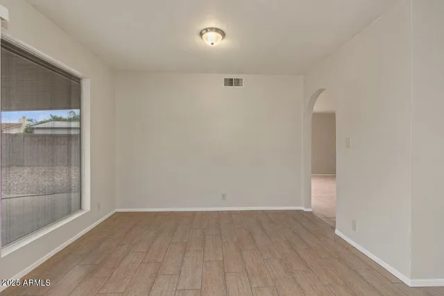 a view of a kitchen with cabinet and a chandelier fan
