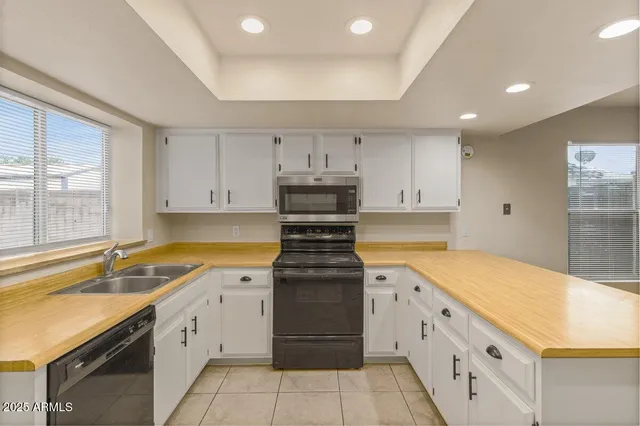 a kitchen with counter top space cabinets and stainless steel appliances