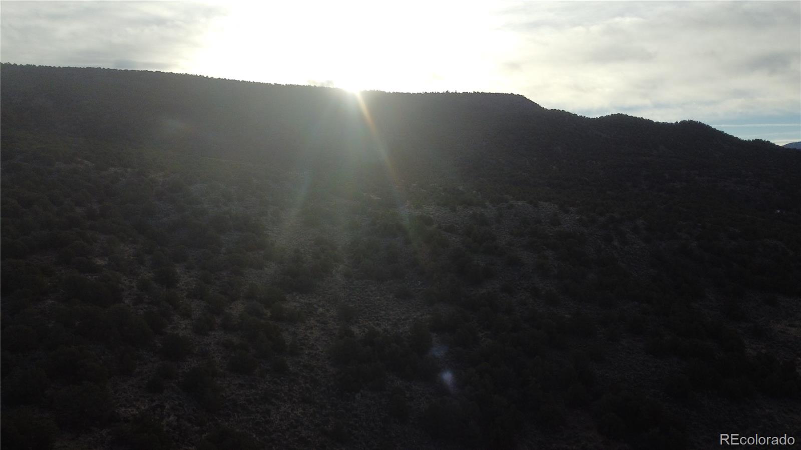 Lot 54 Old Stage Coach Road San Luis, CO 81152 - Photo 16 of 22 a view of a yard in a cloudy sky