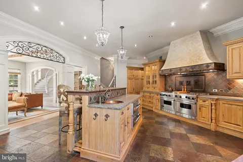 a view of a dining room with furniture wooden floor and chandelier