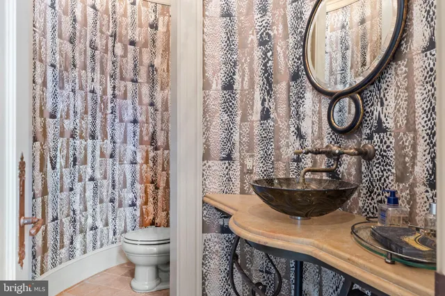 a bedroom with a large bed and a large window