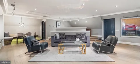 a bathroom with a double vanity sink mirror and bathtub