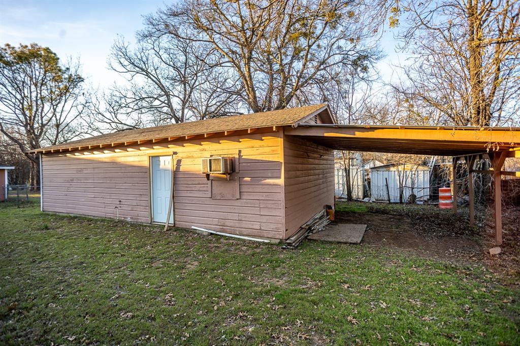 1414 Rice Avenue Gainesville, TX 76240 - Photo 21 of 21 a view of a house with a yard