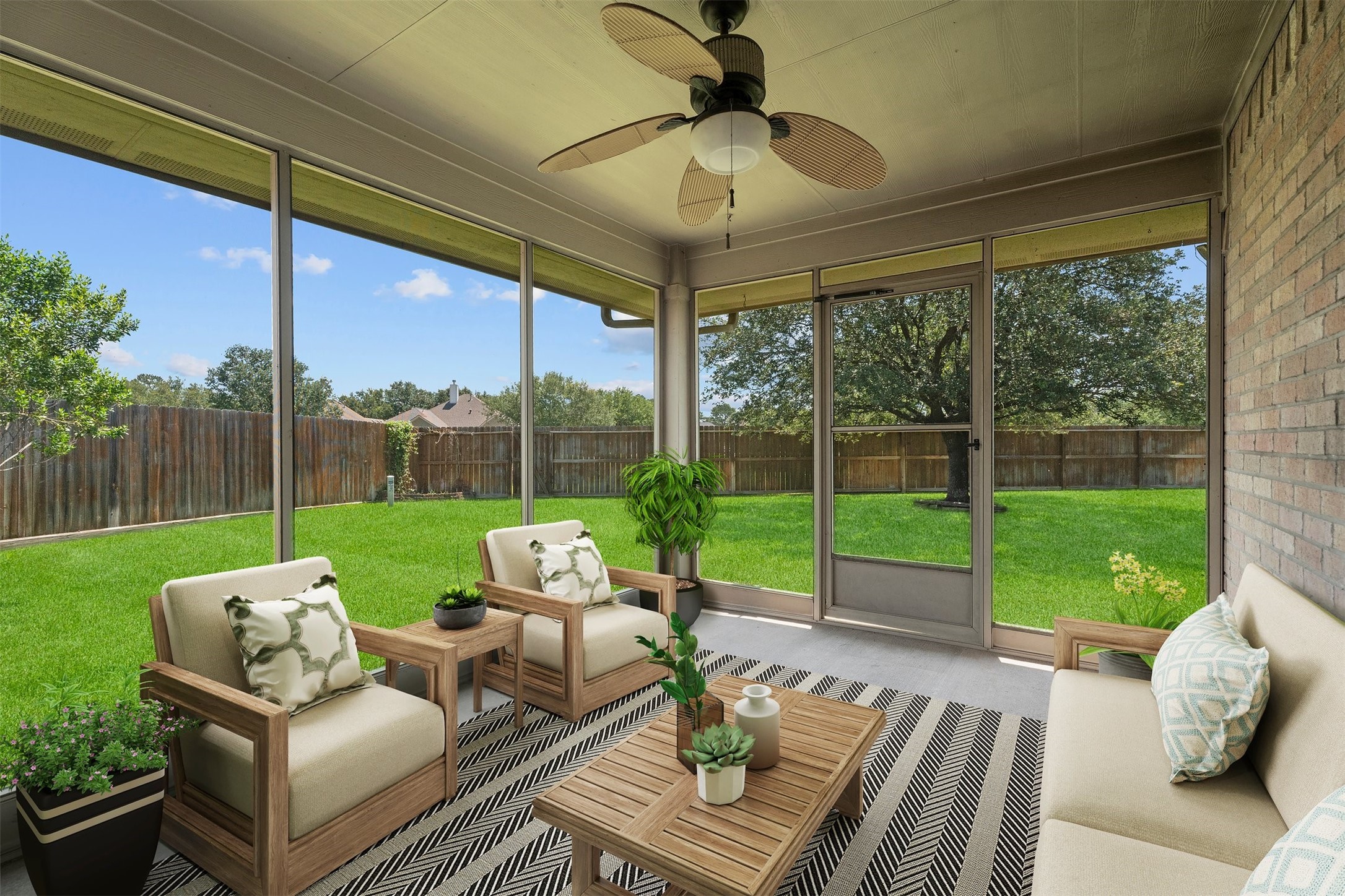 2507 Grayfeather Court Spring, TX 77388 - Photo 27 of 37 Spacious, screened-in patio with a ceiling fan, overlooking a lush, fenced backyard, perfect for outdoor relaxation and entertainment. (Virtually Staged)