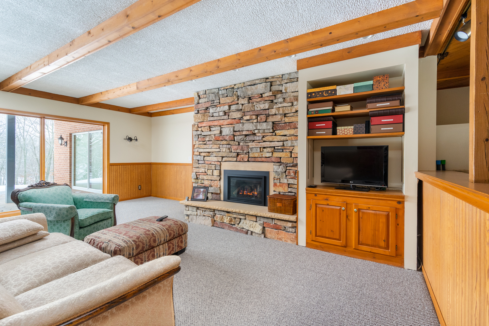 3 Spring Creek Drive Spring Valley, IL 61362 - Photo 25 of 29 a living room with furniture a flat screen tv and a fireplace
