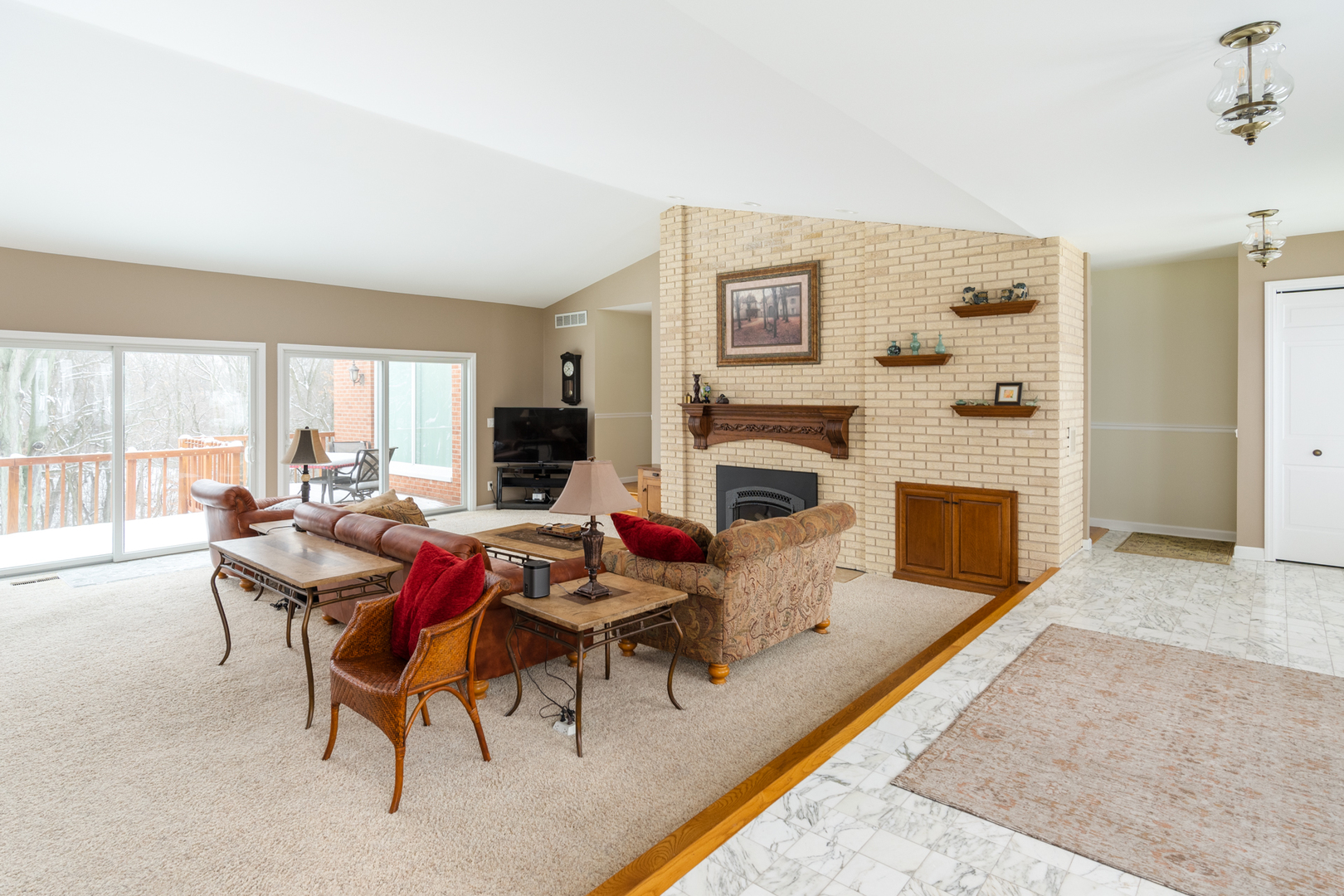 3 Spring Creek Drive Spring Valley, IL 61362 - Photo 10 of 29 a living room with furniture flat screen tv and a fireplace