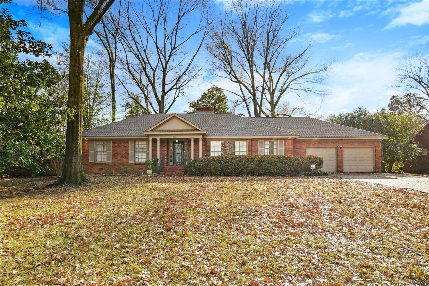 5419 Walnut Grove Road Memphis, TN 38120 - Photo 1 of 29 a front view of a house with yard
