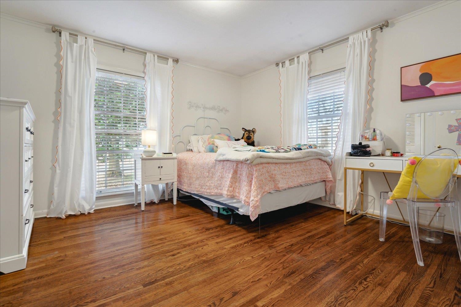 5419 Walnut Grove Road Memphis, TN 38120 - Photo 18 of 29 a bedroom with a bed wooden floor and a window