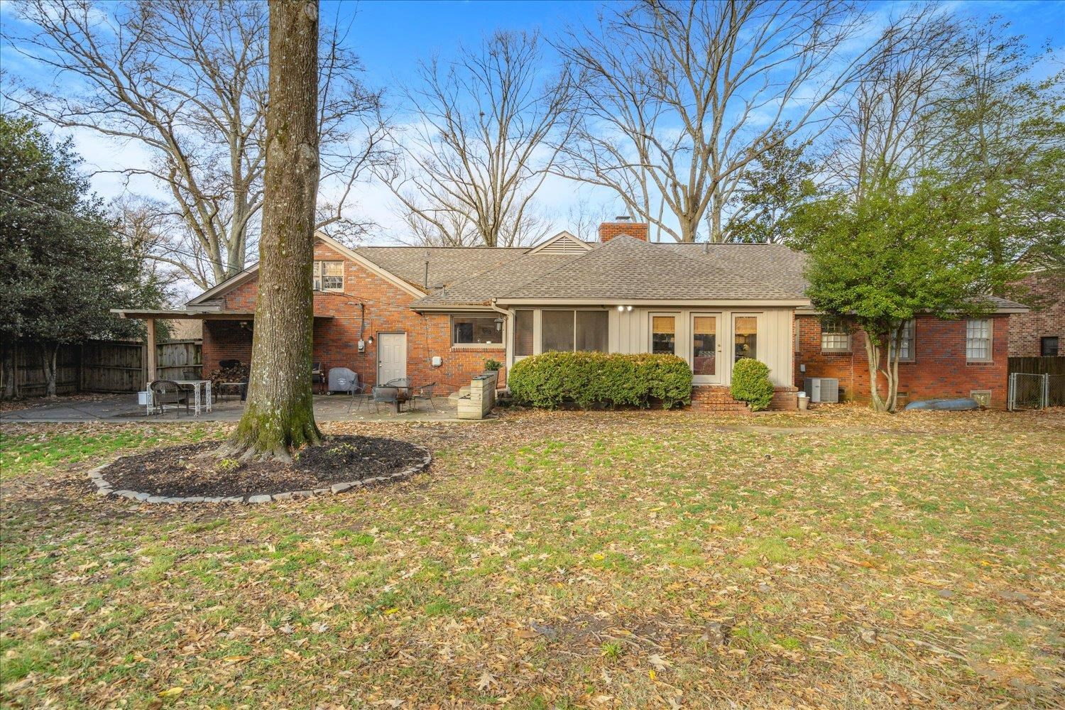 5419 Walnut Grove Road Memphis, TN 38120 - Photo 27 of 29 a front view of a house with a yard