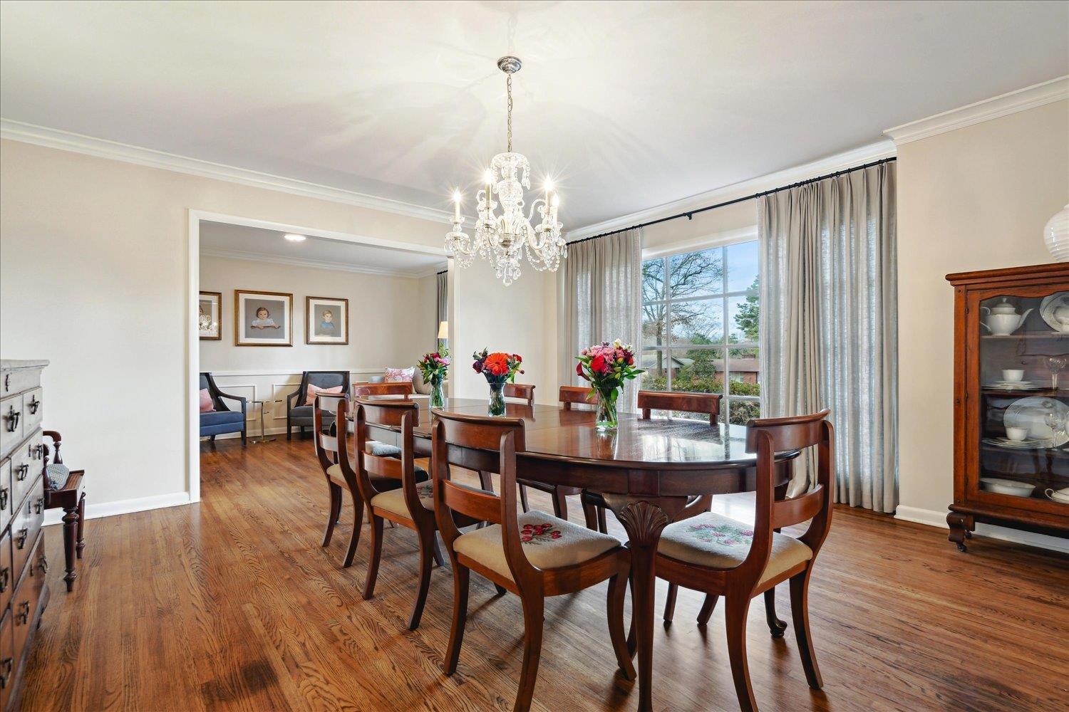 5419 Walnut Grove Road Memphis, TN 38120 - Photo 5 of 29 a view of a dining room with furniture and wooden floor