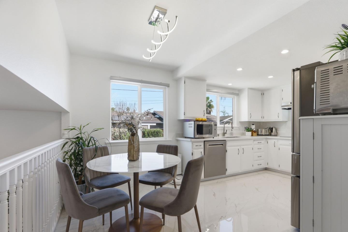 5888 Lean Way San Jose, CA 95123 - Photo 25 of 54 a kitchen with kitchen island a dining table chairs stainless steel appliances and cabinets