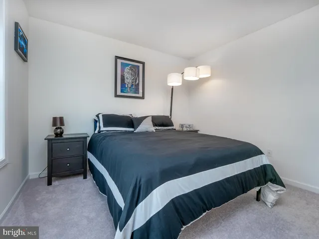 a bathroom with a toilet sink and shower