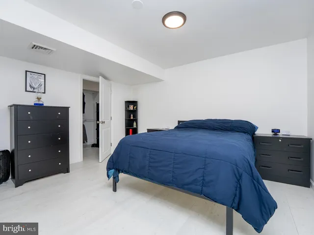 a living room with furniture a desk and chair