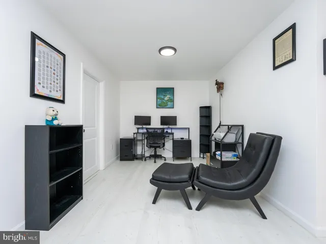 a bathroom with a tub and a toilet