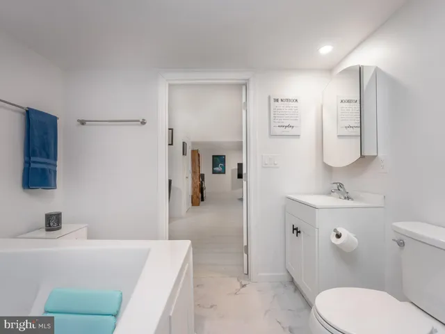 a view of storage and utility room with washer and dryer