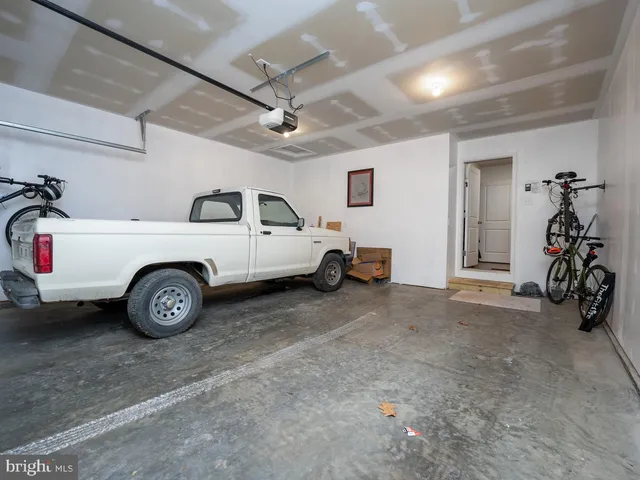 a aerial view of a house with swimming pool and ocean view